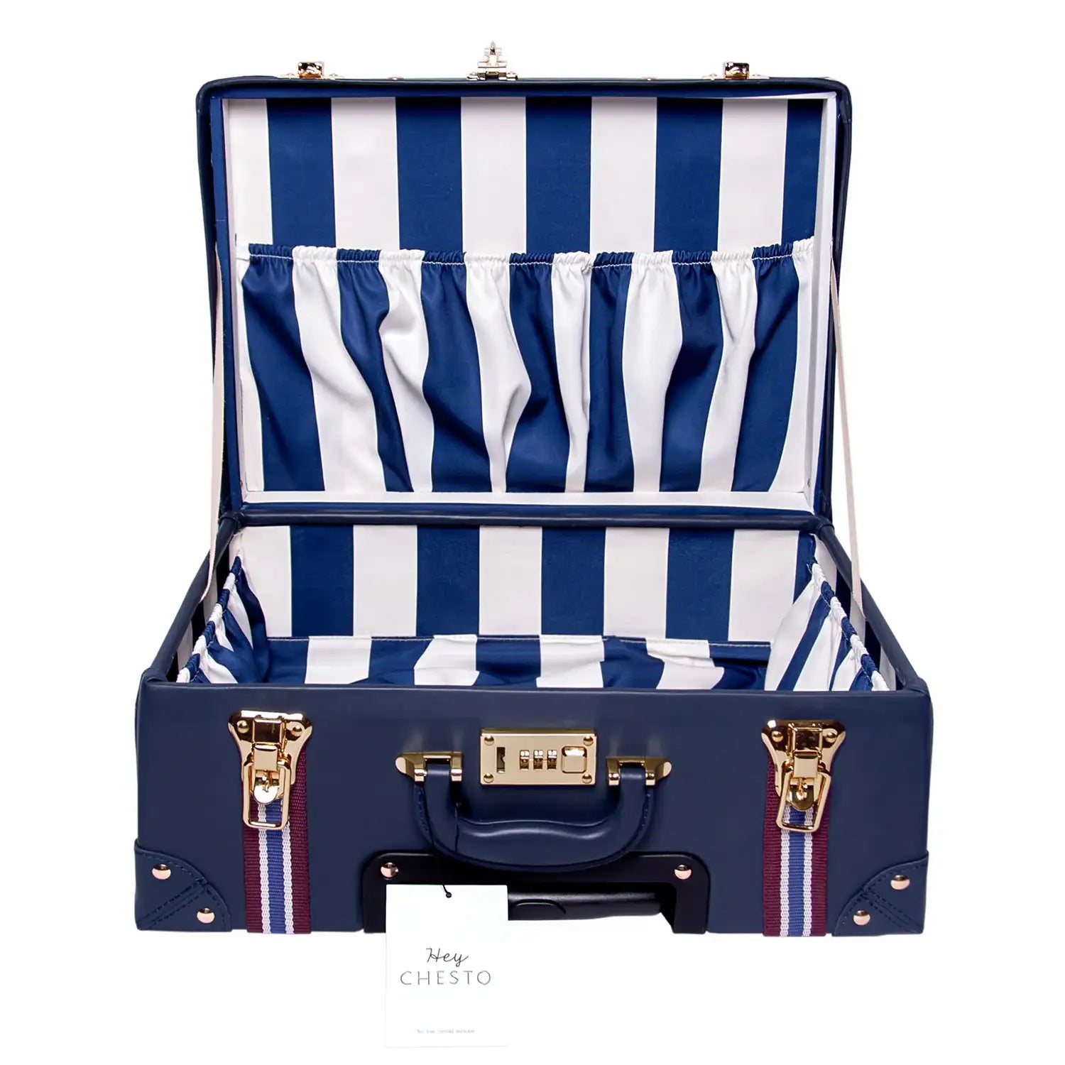 Navy blue vegan leather suitcase with striped interior, gold hardware, and compact travel design