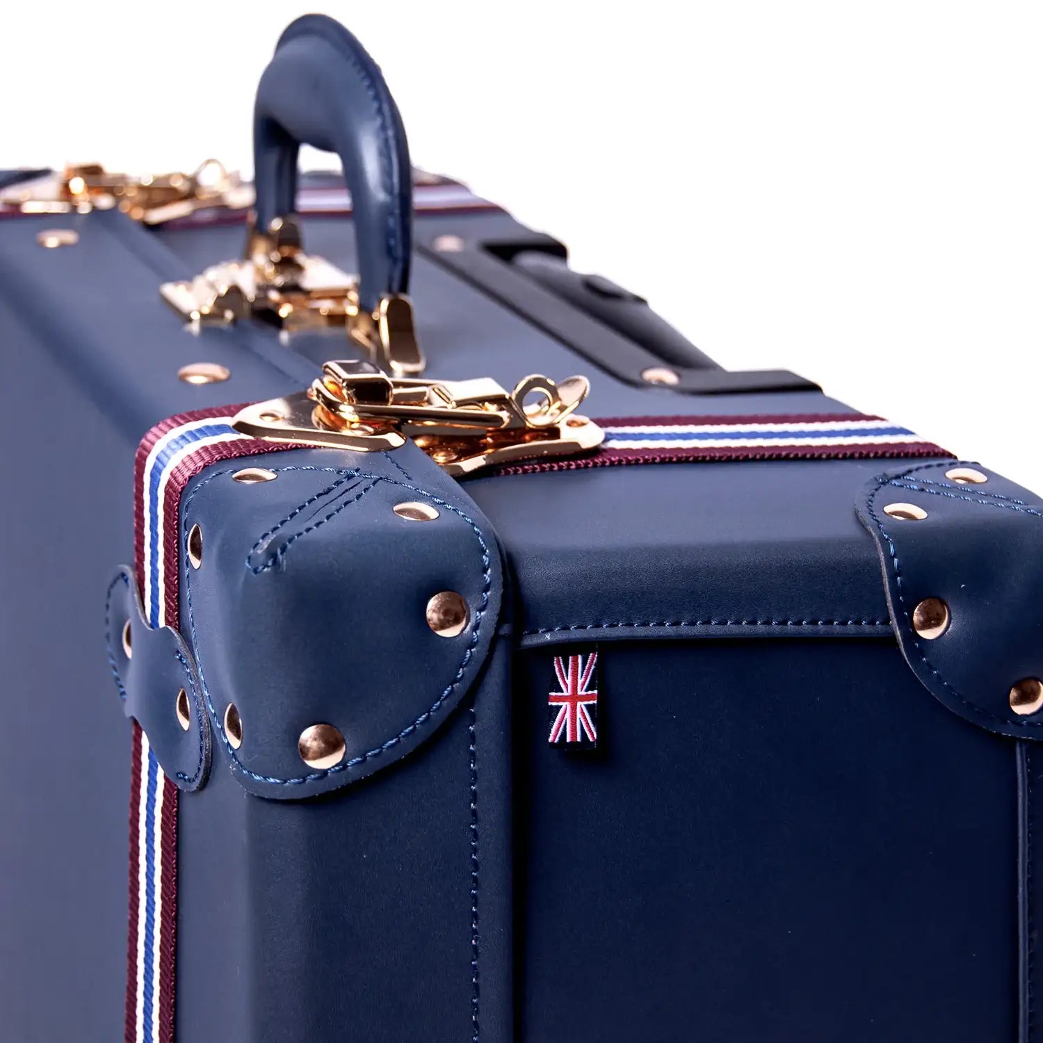 Navy blue vegan leather suitcase with gold hardware and Union Jack flag detail